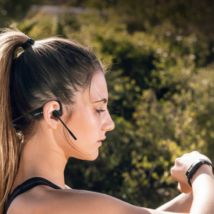 Woman wearing wireless earbuds outdoors with text about product features.