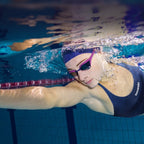 Person swimming underwater with text about closed body hydrophobic material and waterproofing.